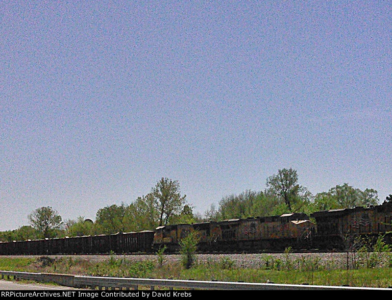 NB ballast train eases uphill to a stop.